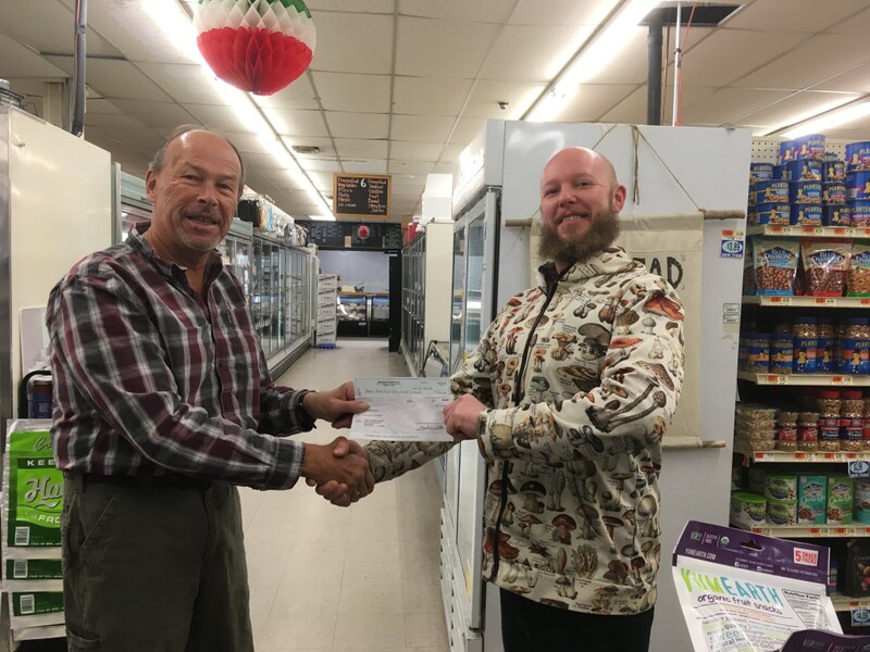 Tom Mehuron Presents a check to Meals On Wheels for the Mad River Valley